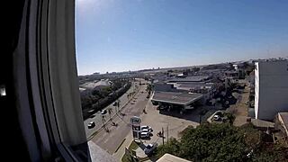 Naked Woman Flashes Big Tits at Hotel Window Near Airport