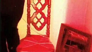 femdom dominates submissive in bondage, breaking chains with heels and music.