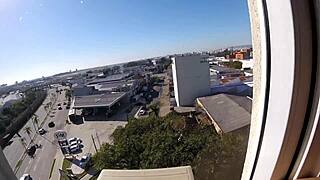 Naked Woman Flashes Big Tits at Hotel Window Near Airport