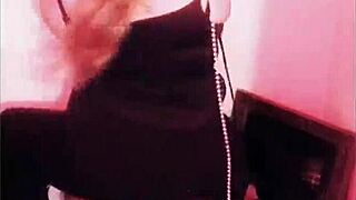 femdom dominates submissive in bondage, breaking chains with heels and music.