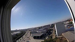 Naked Woman Flashes Big Tits at Hotel Window Near Airport