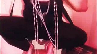 femdom dominates submissive in bondage, breaking chains with heels and music.