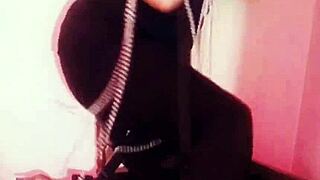 femdom dominates submissive in bondage, breaking chains with heels and music.