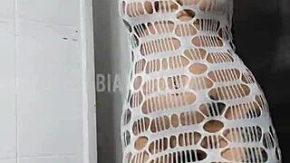 Tattooed brunette dances funk rhythm