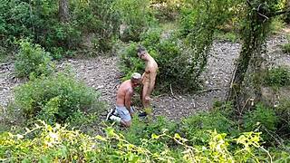 Blowjob for Vadim Romanov's huge dick in the gay cruising forest.