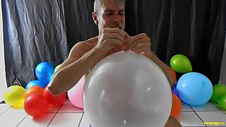 richard lennox plays with balloons and masturbates his big cock