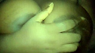 Ebony babe groping her big tits