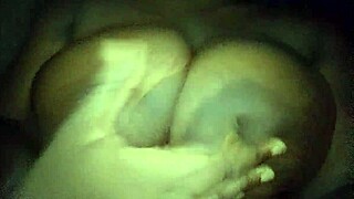 Ebony babe groping her big tits