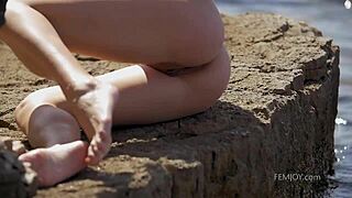 Demi fray teases with striptease and ripped clothes on the nude beach