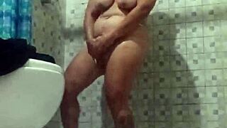 Mature milf exposes big tits and ass in bathroom for assplay humiliation.