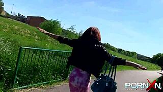 the redhead ebony goddess casually flashes her nude body and pisses outdoors, feeling wild and free