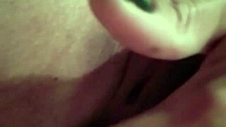 She touches her wet pussy during striptease