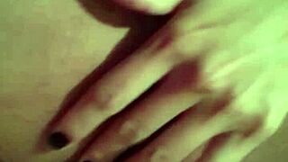 She touches her wet pussy during striptease