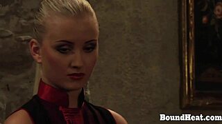 Big tits and ass get flogged and fucked by a lesbian slave couple