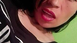 She touches her wet pussy during striptease