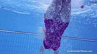 Proklova strips off her bikini and dives naked under water in a steamy scene.