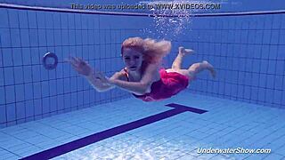 Proklova strips off her bikini and dives naked under water in a steamy scene.