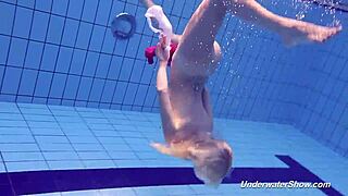 Proklova strips off her bikini and dives naked under water in a steamy scene.