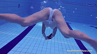 Proklova strips off her bikini and dives naked under water in a steamy scene.