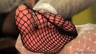 male slave dressed as maid takes shemale's hard dick deep.