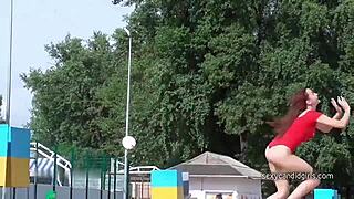 Stunning hottie flaunts delicious ass in red thong swimsuit on candid bikini cam.