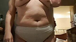 that wife is in the kitchen wearing big panties, looking sexy