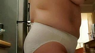 that wife is in the kitchen wearing big panties, looking sexy