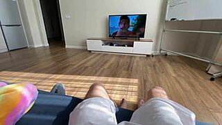 Asian babe watches a movie with him