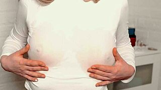 a young beauty teases with juicy breasts and caresses her hairy pussy to climax.