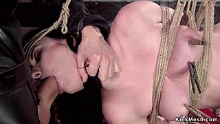 slave endures suspension bondage while getting anal fucked. pain and pleasure mix in kinky group scene.