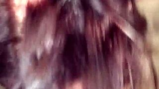 A woman performs oral on a black man