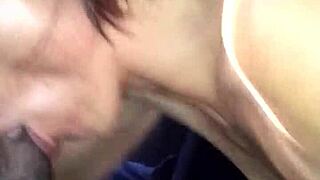 A woman performs oral on a black man