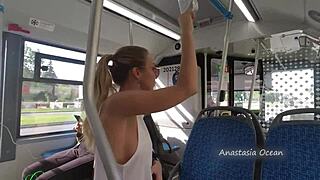 A woman exposes her breasts on a public transportation vehicle