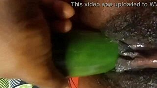 Cyndy Blackslave Stuffs Her Tight Ebony Pussy with Cucumber Until Squirting