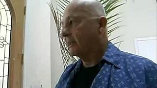 An old grandpa shares a quiet, personal moment with a young companion in private.