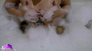 uh, cute teen babe sloppy suckin’ huge dildo in foamy bath... damn hot!