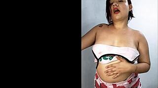 Beautiful young woman shows her big natural tits and wet pussy