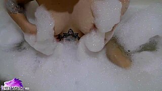 uh, cute teen babe sloppy suckin’ huge dildo in foamy bath... damn hot!