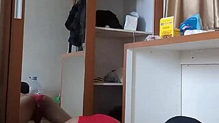 Sexy gay in red cd and mask plays with toys