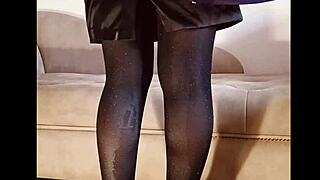 Amateur in shiny pantyhose pees in a softcore fetish scene.