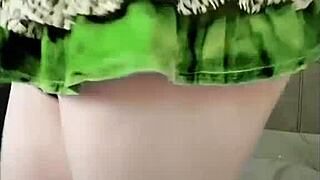 hey, check out this sissy crossdresser in a pink shirt and black mini skirt with a big butt.