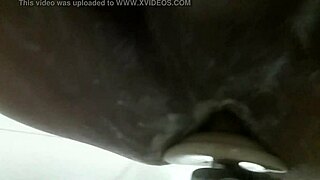 In the shower, he pleasures himself with a dildo