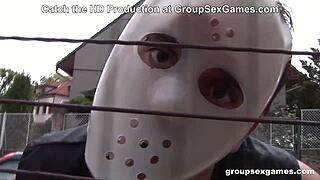 A group of masked individuals participate in a Halloween-themed event.