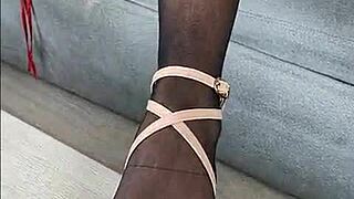 Kenia teases in black stockings and red satin dress