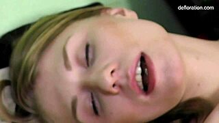 Petite teen Gwyneth Petrova shows off big tits while masturbating.