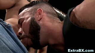 Hunks hook up in a garage.