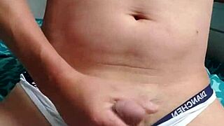 A gay boy masturbates in underwear.