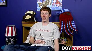 red-haired guy chats before diving into solo toy play with huge dildo