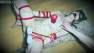 hey, why is this bound slave holding a vibrator like a candlestick?