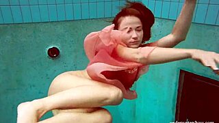 hot deniska strips underwater as naked teen in bikini